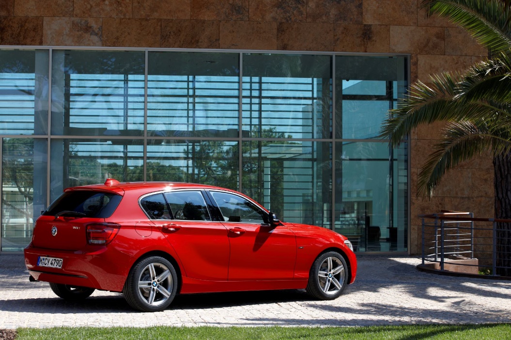 A red car parked in front of a building

Description automatically generated with medium confidence